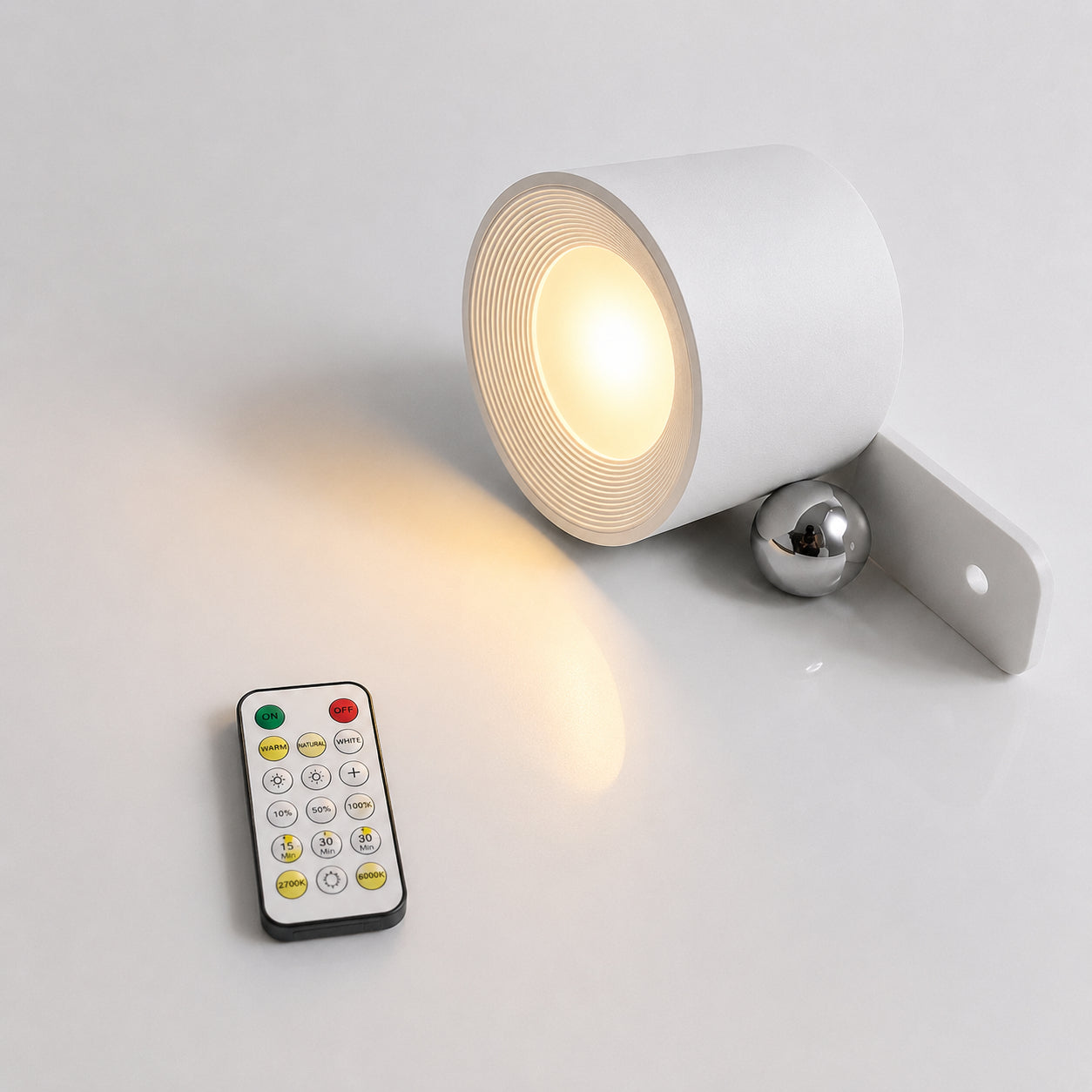 White outdoor light fixture with remote control on a light gray background